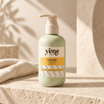 Yazie Conditioner by Yene Hair in a sage green pump bottle on a neutral stone background