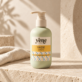 Yazie Conditioner by Yene Hair in a sage green pump bottle on a neutral stone background