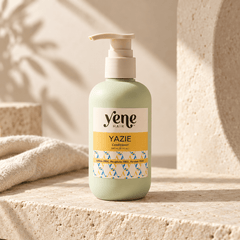 Yazie Conditioner by Yene Hair in a sage green pump bottle on a neutral stone background