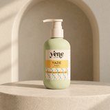 Yazie Shampoo by Yene Hair in a sage green pump bottle on a neutral stone background